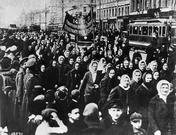 International women's day, women (mainly textile workers) demonstrate on petrograd's (st, petersburg) nevsky prospect shortly after the establishment of a provisional government, russia, february 1917, the soldiers' families are demanding increased rations for the troops, the banner reads 'comrade workers and soldiers, support our demands'.
