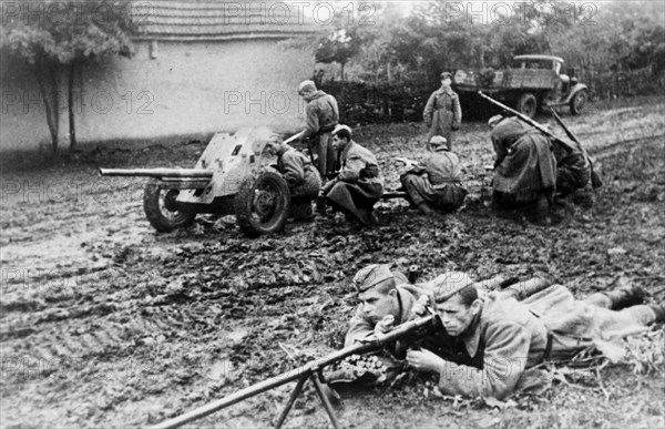 The crew of an anti-tank gun in the northern caucasus taking a strategic position, fires at enemy tanks which attempt to break through to the village.