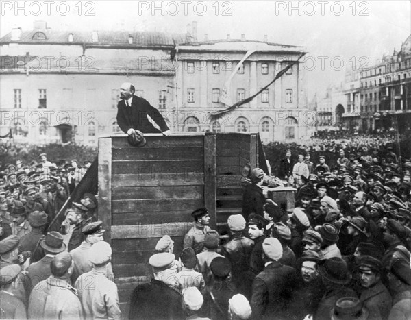 V,i, lenin speaking to red army troops leaving for the front (civil war period), sverdlov square, moscow, may 5th 1920, this is an altered image: the figure of leon trotsky standing in the area with steps behind the speakers' platform has been painted out.