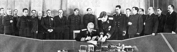 A,y, vishinsky signing the treaty of friendship, alliance, and mutual assistance between the soviet union and the chinese people's republic in 1950, (left to right: a,a, gromyko, n,a, bulganin, n,v, roshchin, chou enlai, a,i, mikoyan, n, khrushchev, k, voroshilov, v,m, molotov, stalin, mao zedong, b,v, podtserop, n,t, fedorenko, wang cha hsiang, g,m, malenkov, cheng po ta, l,p, beria, mr, azizov, and l,m, kaganovich).