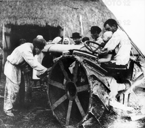 The first tractor on a kolkhoz (collective farm), 1929 - 1930.