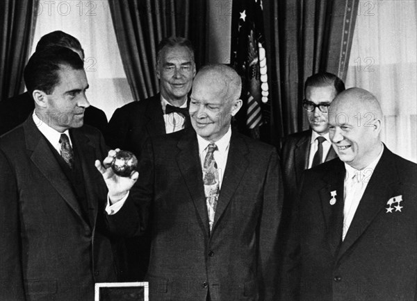 Nikita khrushchev with president dwight d, eisenhower and vice-president richard m, nixon at the whitehouse on september 16, 1959, khrushchev just presented the president with a copy of the pendant that was deposited on the moon by a soviet space rocket (luna 2).