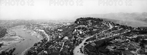 A view of chungking, leading industrial and trade center in southwest china, surrounded on three sides by rivers, early 1950s.