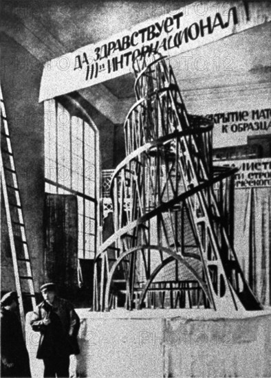 The monument to the third international (tatlin's tower) by vladimir tatlin, the model of the proposed tower in the studio of materials, volume, and construction (the former academy of arts) in petrograd, 1920.