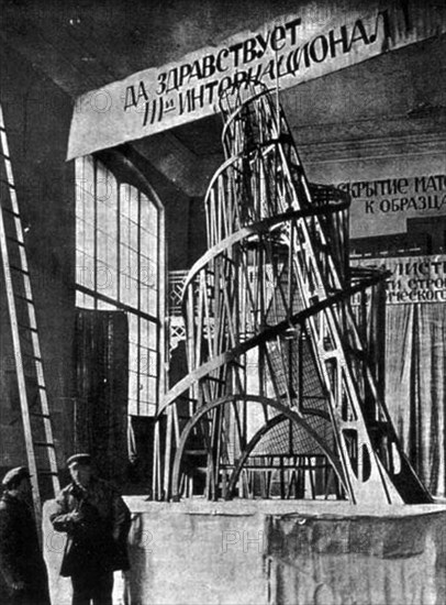 The monument to the third international (tatlin's tower) by vladimir tatlin, the model of the proposed tower in the studio of materials, volume, and construction (the former academy of arts) in petrograd, 1920.