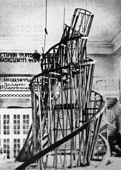 The monument to the third international (tatlin's tower) by vladimir tatlin, the model of the proposed tower in the studio of materials, volume, and construction (the former academy of arts) in petrograd, 1920.