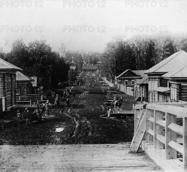 A view of the village of kudymkar in northern russia in the late 1800s or early 1900s.