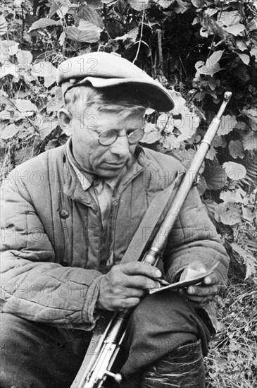 World war 2, a russian partisan signing the 'oath of a red partisan', september 1941.