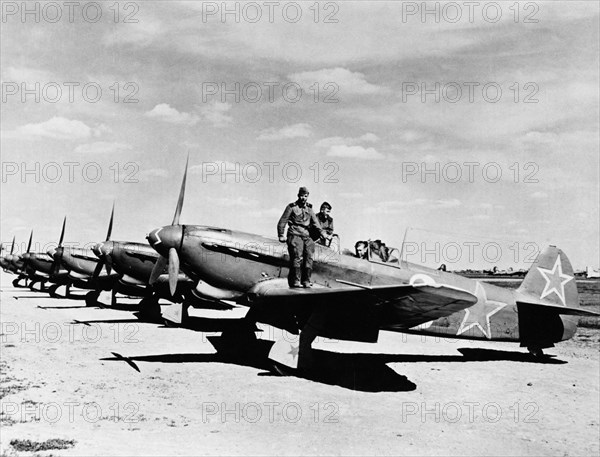 World war 2, soviet air force yakovlev yak-9d fighters lined up on an airfield, the squadron guards the new u,s, bases for aircraft landing in the soviet union.