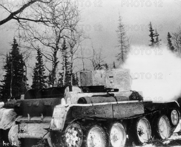 Soviet-finnish war, 1939-1940, a soviet red army tank firing, a still from the newsreel documentary film, 'mannerheim line'.