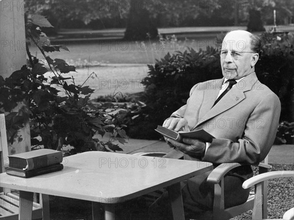 Walter ulbricht, state council chairman and first secretary of the central committee of the socialist unity party (sed), reading a book in the park of the residence of the state council, june 25, 1963.