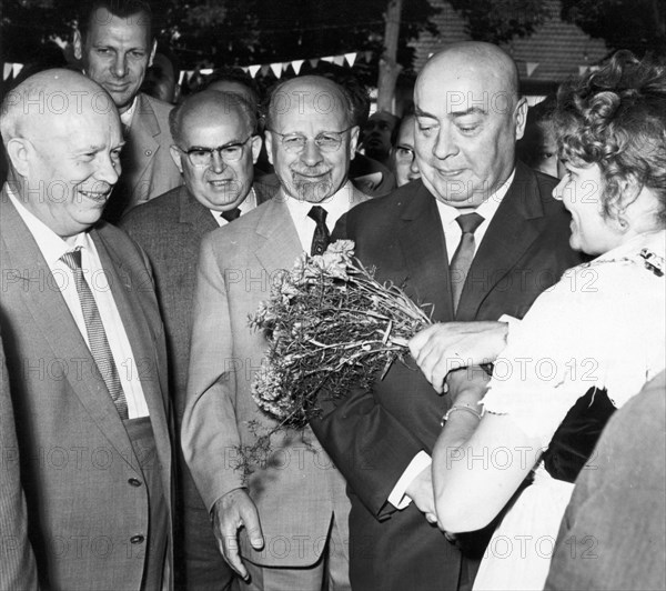Soviet premier nikita khrushchev, gdr state council chairman walter ulbricht, and the minister council chairman of poland jozef cyrankiewicz being welcomed with flowers in the town hall of frankfurt prior to a great demonstration on july 3, 1963.