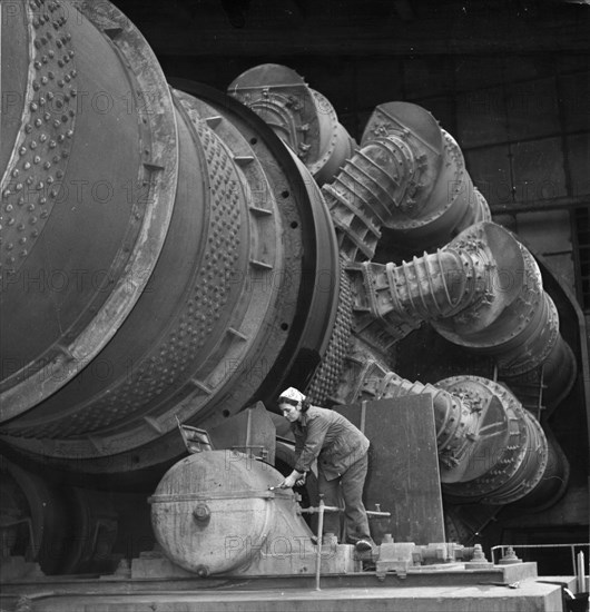 Woman working on a furnace in the 'vulkan' cement plant, 1964.
