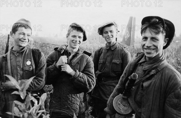 Four young partisans who just set fire to a junkers-52, a german transport plane that made a forced landing, world war 2.