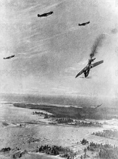 German plane being shot down by soviet fighter planes during a dogfight on the northwestern front.