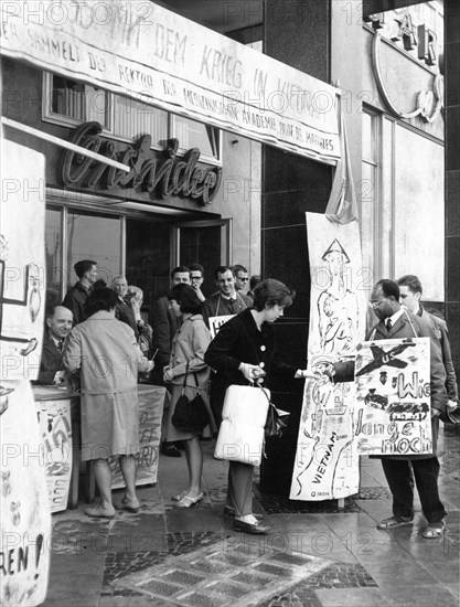 The professors of the medical academy in magdeburg, gdr in front of the international hotel collecting signatures against us aggression in vietnam and donations of solidarity with the vietnamese people, may 1966.