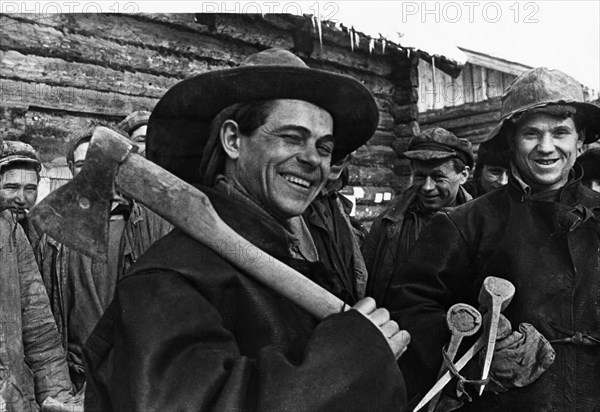 Gold miners on their way to work in a shaft of the artemovsky gold mine, of the 'lenzoloto' (lena gold) trust, eastern siberia, april 1937.