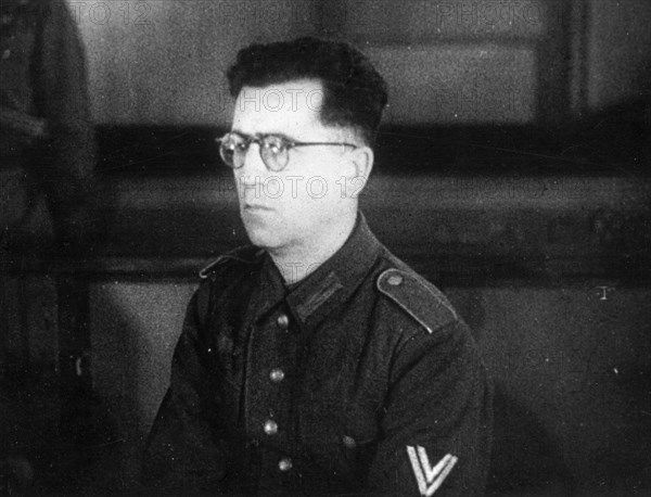 World war 2, december 15, 1943, still from a film on the kharkov trial produced by artkino, senior corporal of the auxiliary police, reinhard retzlaw, an officer of the 560th group of the german secret field police, on trial at kharkov.
