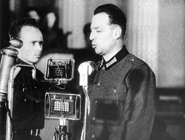 World war 2, december 15, 1943, still from a film on the kharkov trial produced by artkino, wilhelm langheld pleads guilty, langheld spoke in german which was translated by the man at his side.
