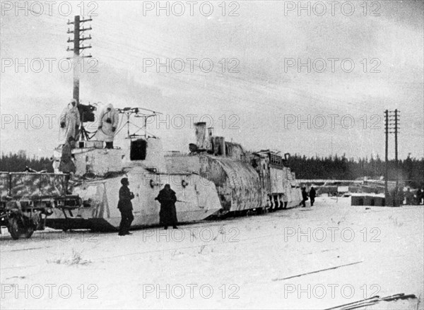 Soviet-finnish war, 1939-1940, a finnish armored train captured by the red army, the near car has light field guns, machin-guns, and wireless, the far car is the locomotive, a still from the newsreel documentary film, 'mannerheim line'.