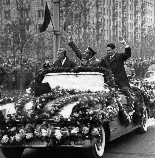 Voskhod 1, soviet cosmonauts (l to r) constantine feoktistov, vladimir komarov, and boris yegorov being greeted by residents after landing at vnukovo airport in moscow, october 1964.