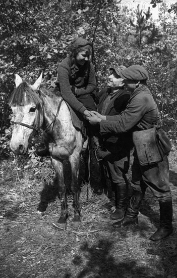 World war 2, in the very first days of the german occupation, dussya davidovich joined a guerilla detachment as a medical nurse, when her detachment merged into the red army the girl asked command for permission to join the red army, here she is parting with her partisan friends upon leaving for an army unit.