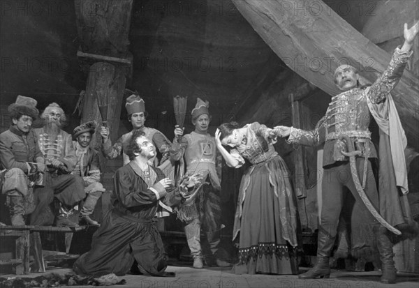 A scene from the first act of 'solomon maimon' a new play by m, daniel being staged by the state jewish theater in moscow under the direction of people's artist of the ussr, solomon mikhoels, november 1940, in maimon's inn, count radzivill (i, shidlo) makes an attempt to carry off the wife (e, itskhoki) of maimon (v, zuskin).