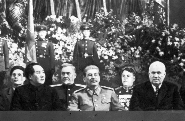 Communist leaders from two continents at the bolshoi theater in moscow at a meeting in honor of josef stalin's 70th birthday on december 21, 1949, (left to right: suslov, mao zedong, bulganin, stalin, vassilevsky, and khrushchev).