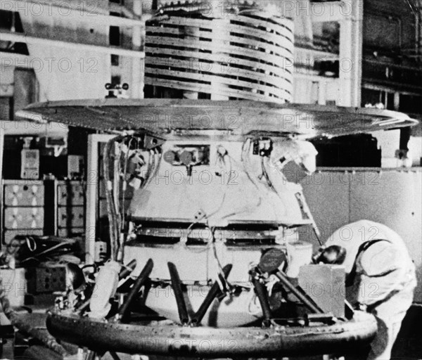 The descent capsule of the soviet space probe venera 9 being worked on in the assembly shop,1975.