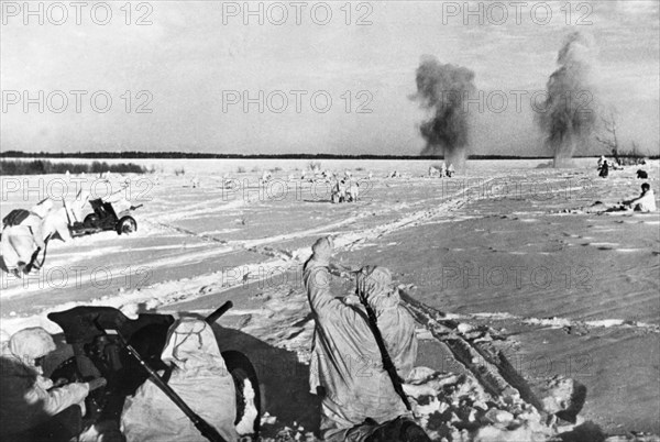 Soviet red army infantry advancing on german positions during winter fighting on the western front.