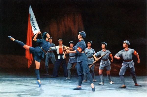 The modern revolutionary ballet 'red detachment of women', from a chinese postcard set published in 1970, 'after our main force has safely moved out, hung chang-ching solemnly unstraps his dispatch case and asks wu ching-hua, who has been admitted to the communist party on the front line, to deliver it to the battalion party committee,'.
