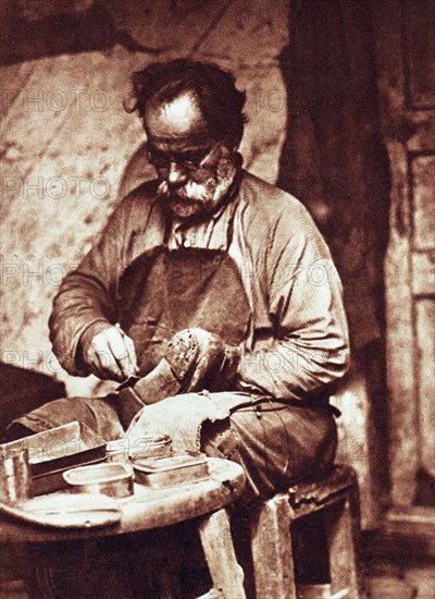 A cobbler in kiev, ukraine, 1928.