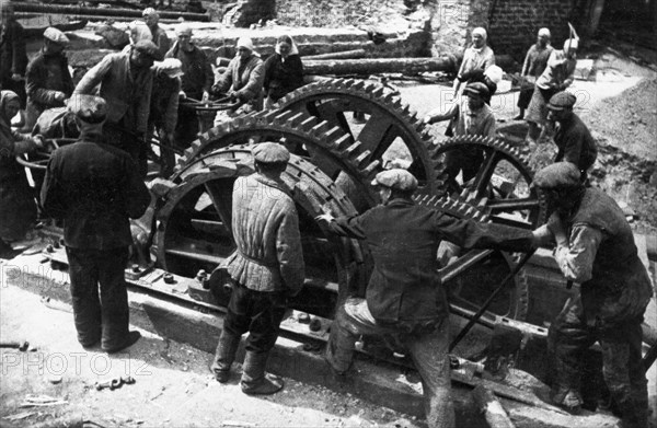 World war 2, miners fixing a 15 ton winch to be able to resume work at the donbass mines, ukraine.