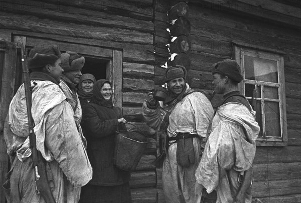 World war 2, battle of stalingrad, two women offering red army soldiers a drink - liberation of stalingrad, 1943.