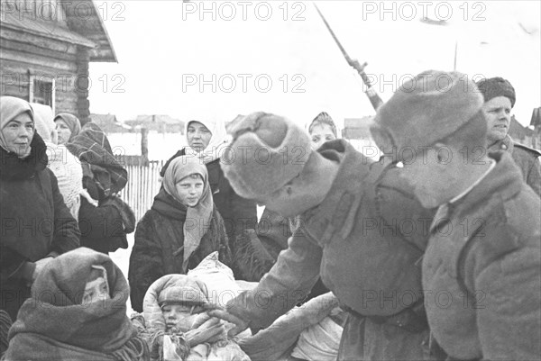 World war 2, battle of stalingrad, red army soldiers with civilians on the outskirts of stalingrad.