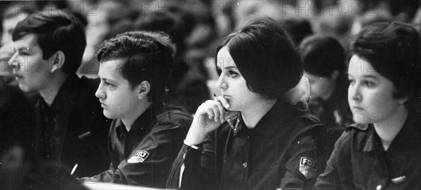 Conference of the best apprentices of the gdr in which opinions were exchanged with members of the various branches of the free german trade unions regarding new problems of modern voational training, free german youth organization members at the meeting in leipzig, april 1969.