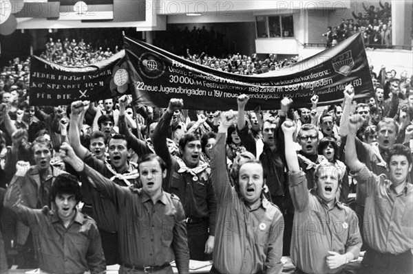 Free german youth organization, a meeting at a youth conference in berlin in which a resolution to make every effort to have the gdr host the next world youth festival is adopted unanimously, october 23, 1972.