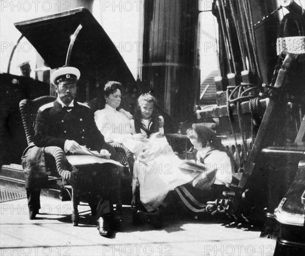 The royal couple of russia, tsar nicholas ll and tsarina alexandra fyodorovna aboard the royal yacht with two of their children.