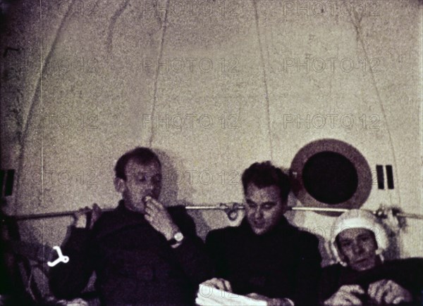 Cosmonauts vladimir shatalov, evgeni khrunov, alexei eliseyev, and boris volynov eating dinner aboard soyuz 4 after leaving soyuz 5, july 1969.