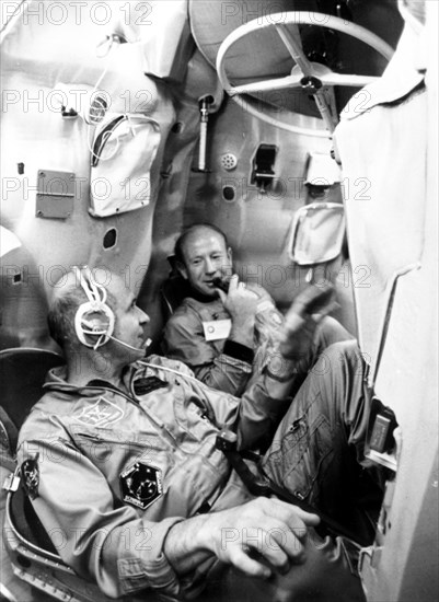 July 9, 1974, yuri gagarin spacemen's training centre, alexei leonov, commander of the first soyuz crew (right), thomas stafford, commander of the apollo flight crew, training in a mock-up soyuz spacecraft.