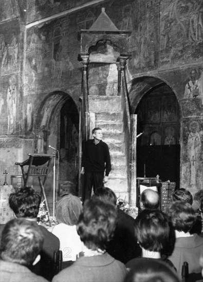 Struga's evenings of poetry' a festival featuring some 50 poets from yugoslavia, ussr, czechoslovakia, gdr, italy, greece, romania, and bulgaria that takes place in the town of struga on the shore of ohrid lake in macedonia, august 26-29, 1965, yevgeny yevtushenko performing at st, sophia church in the town of ohrid.