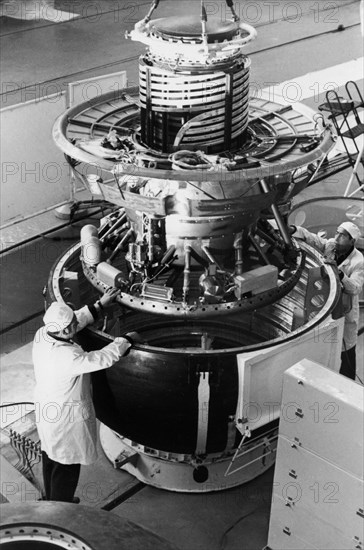 Technicians assembling the venera descent module of the soviet space probe vega at the baikonur cosmdrome, 1984.