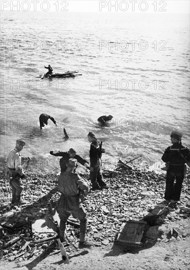World war 2, soviet sailors capturing germans as they try to escape on rafts after the taking of kerch in the crimea.