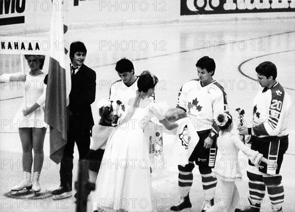 Traditional 'bread and salt' of hospitality being presented to the canadian ice hockey team during the opening ceremonies of the izvestia prize international ice hockey tournament on december 16, 1986.