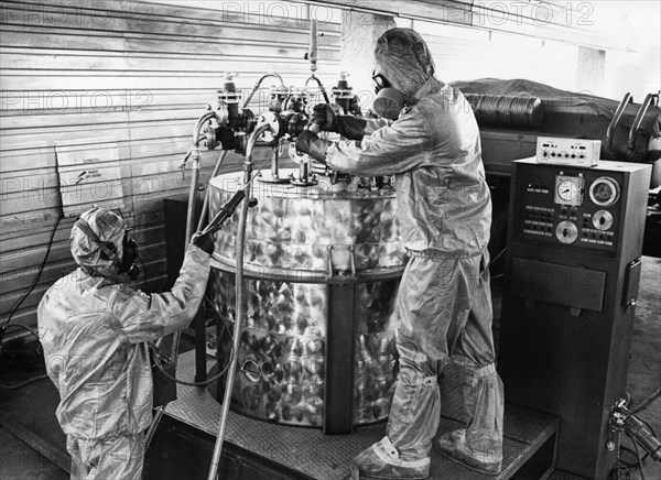 Technicians in protective suits operating a mobile chemical agents destruction unit at soviet military base of shikhany, saratov region, ussr, october 4th 1987, diplomats and military experts from 45 countries witnessed a mass decommissioning of chemical weapons.