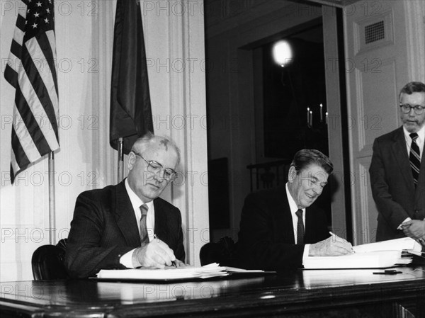 Mikhail gorbachev and ronald reagan, signing the treaty between the usa and the ussr on the elimination of intermediate and short-range missiles, in the white house on december 8, 1987.