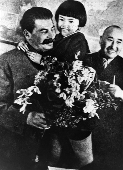 Joseph stalin receiving a bouquet of flowers from engelsina (gelya) markizova, the 7-year-old daughter of the second secretary of the buryat-mongolian regional party committee in 1936, stalin had him executed the following year, her mother was arrested and exiled to kazakhstan where she died under suspicious circumstances in 1940.