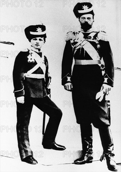 A portrait of tsar nicholas ll with his son alexei wearing military uniforms.