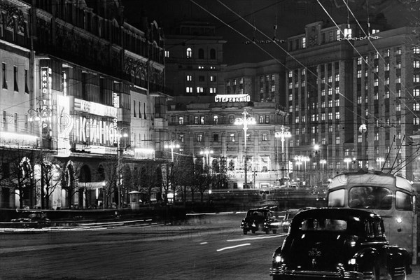 Movie theaters on 'theater thoroughfare' at night in moscow, ussr, december 1958.