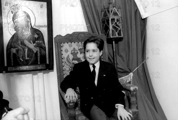 Kostroma, russia 9/92: 11-year-old grand duke georgy mikhailovich romanov sits in the czar's chair in the ipatyevsky monastery, where the first romanov, mikhail, sheltered his mother in 1613 during the time of troubles .